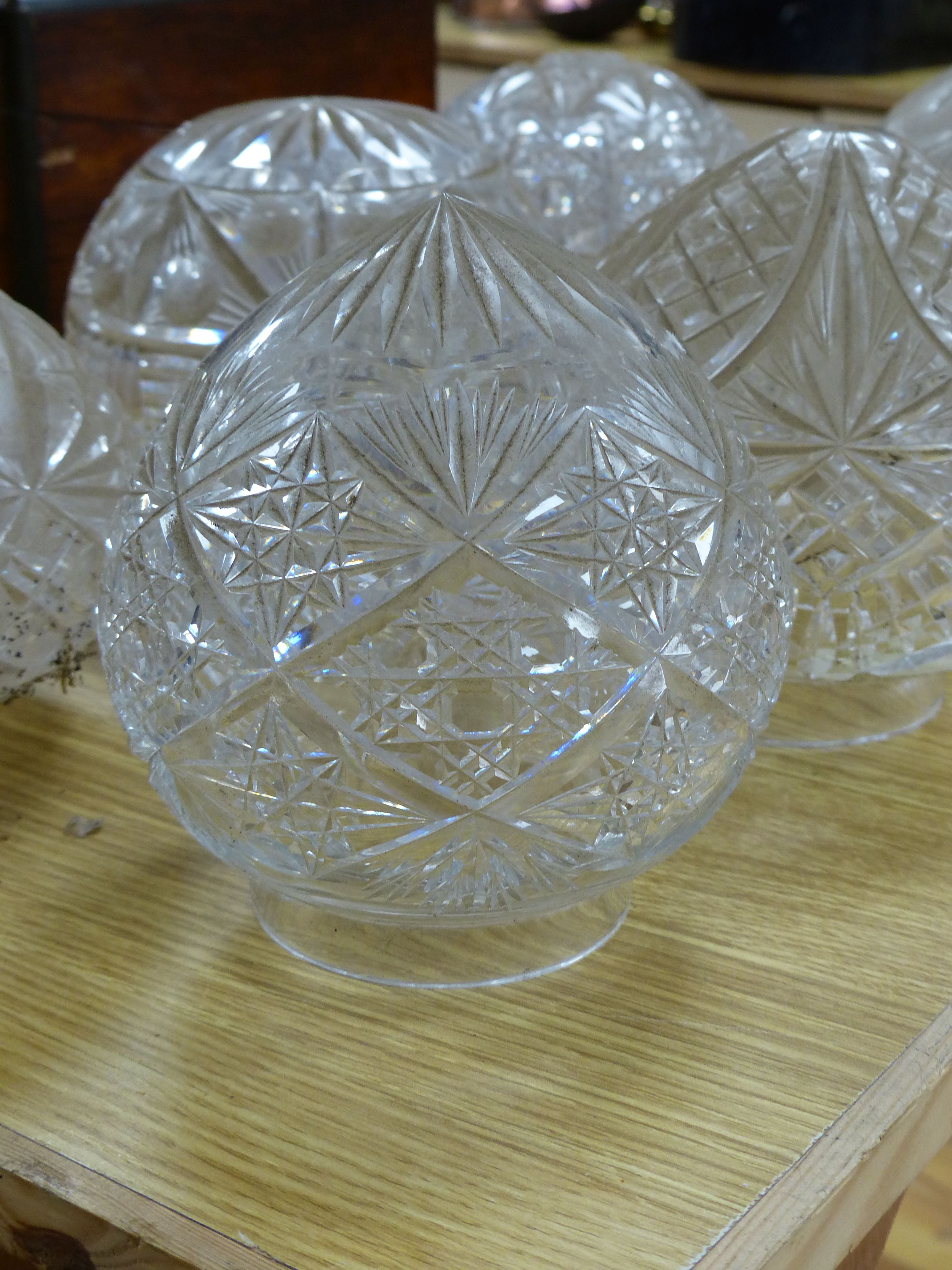 A collection of circular cut glass table lamp shades (6)